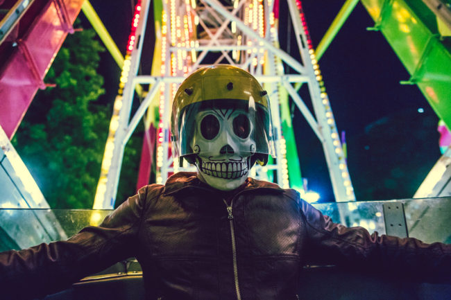 Frank Aberdean Something Wicked This Way Comes by Mako Miyamoto skull skeleton horror killer red day of the dead superhero leather badass visor carny circus lights carnival summer