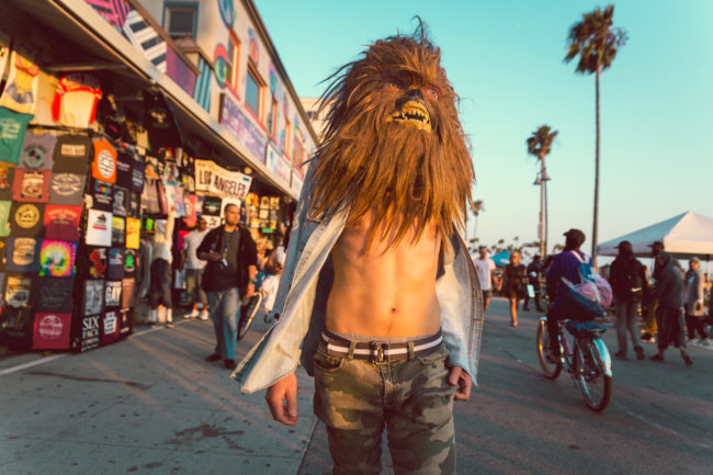 California Dreaming Photograph by Mako Miyamoto. Wookie walking in Venice Beach California with his shirt open in the afternoon