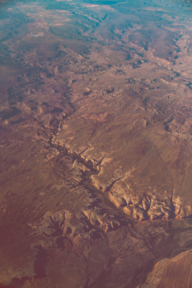 Falling Up by Mako Miyamoto clouds sky blue flight travel mountains photography desert