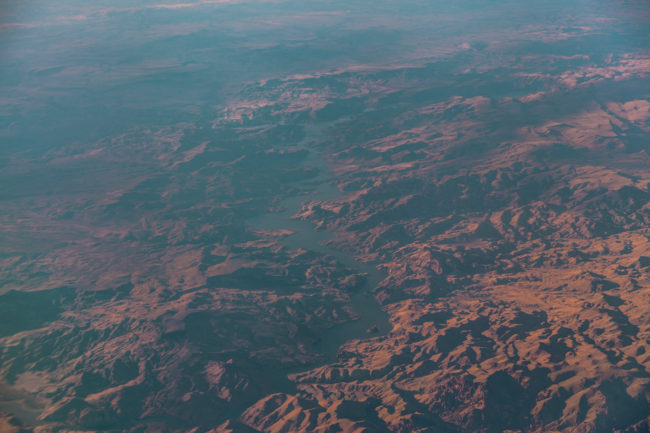 Falling Up by Mako Miyamoto clouds sky blue flight travel mountains photography desert