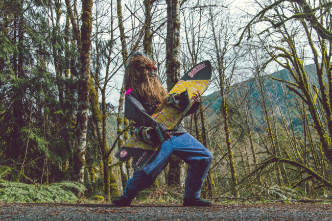 Shred or Die Photograph by Mako Miyamoto. Snowboarder wookie on Mount Hood Oregon rocking out with a snowboard in the forest
